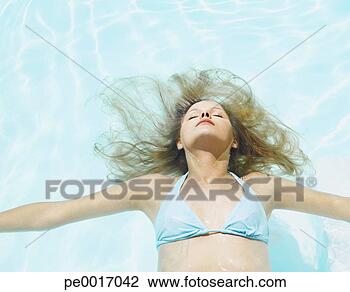 Stock Photo - woman floating 
in water. fotosearch 
- search stock 
photos, pictures, 
images, and photo 
clipart