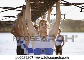 Picture - athletes carrying 
a crew row boat 
over heads. fotosearch 
- search stock 
photos, pictures, 
images, and photo 
clipart