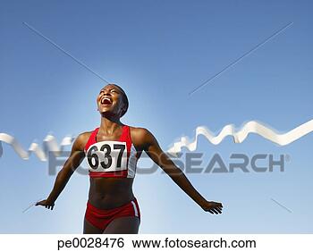 Stock Photo - racer crossing 
the finish line 
smiling. fotosearch 
- search stock 
photos, pictures, 
images, and photo 
clipart