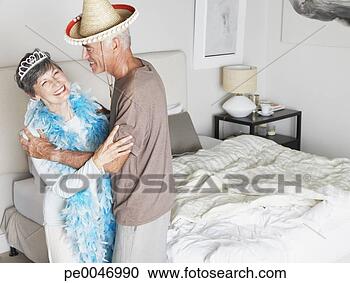 Stock Photography - a couple dancing 
in their bedroom. 
fotosearch - search 
stock photos, 
pictures, images, 
and photo clipart