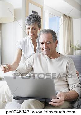 Stock Photo - a couple online 
shopping. fotosearch 
- search stock 
photos, pictures, 
images, and photo 
clipart