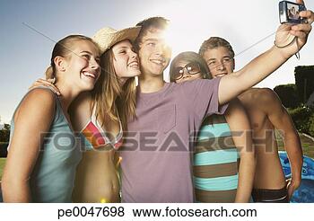 Stock Photo - friends hanging 
out by a pool 
taking pictures. 
fotosearch - search 
stock photos, 
pictures, images, 
and photo clipart