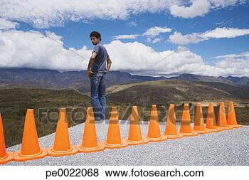 Stock Photo - man cornered by 
a row of safety 
cones. fotosearch 
- search stock 
photos, pictures, 
images, and photo 
clipart