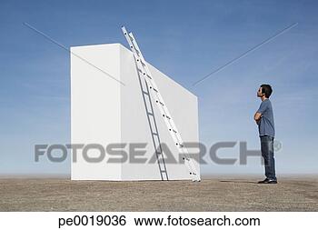 Stock Photo - man looking at 
ladder against 
wall outdoors. 
fotosearch - search 
stock photos, 
pictures, images, 
and photo clipart