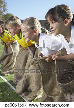 Picture - kids potato sack 
racing. fotosearch 
- search stock 
photos, pictures, 
images, and photo 
clipart