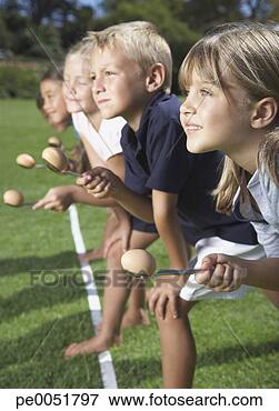Picture - kids racing while 
carrying eggs 
in spoons. fotosearch 
- search stock 
photos, pictures, 
images, and photo 
clipart