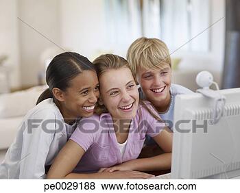 Stock Photo - three young kids 
on a computer. 
fotosearch - search 
stock photos, 
pictures, images, 
and photo clipart