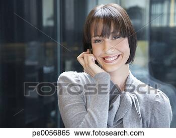 Stock Image - businesswoman 
on her mobile 
phone. fotosearch 
- search stock 
photos, pictures, 
images, and photo 
clipart