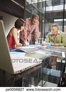 Picture - three businesspeople 
in an office. 
fotosearch - search 
stock photos, 
pictures, images, 
and photo clipart