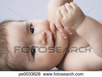 Stock Photo - a baby girl lying 
down. fotosearch 
- search stock 
photos, pictures, 
images, and photo 
clipart