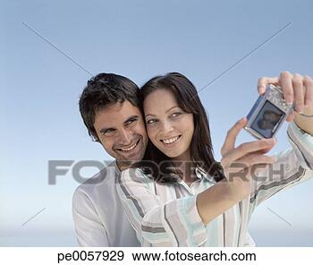 Stock Photograph - a couple taking 
pictures outdoors. 
fotosearch - search 
stock photos, 
pictures, images, 
and photo clipart