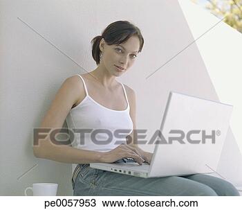 Stock Photo - a woman on her 
laptop. fotosearch 
- search stock 
photos, pictures, 
images, and photo 
clipart