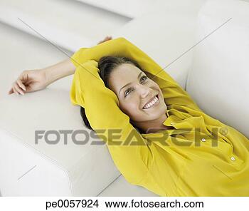 Stock Photo - a woman lying 
back on a couch. 
fotosearch - search 
stock photos, 
pictures, images, 
and photo clipart
