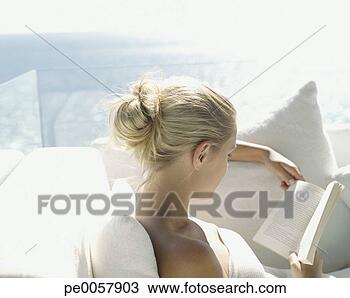 Stock Photo - a woman reading 
a book. fotosearch 
- search stock 
photos, pictures, 
images, and photo 
clipart