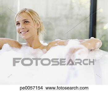 Stock Photo - a woman in a bathtub. 
fotosearch - search 
stock photos, 
pictures, images, 
and photo clipart