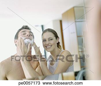 Stock Photo - a woman helping 
a man shave. fotosearch 
- search stock 
photos, pictures, 
images, and photo 
clipart