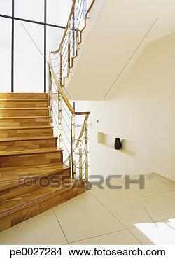 Stock Photo - modern stairs 
with large windows 
at landing. fotosearch 
- search stock 
photos, pictures, 
images, and photo 
clipart