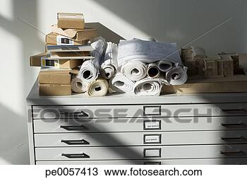 Stock Photo - architect supplies 
on top of a filing 
cabinet. fotosearch 
- search stock 
photos, pictures, 
images, and photo 
clipart