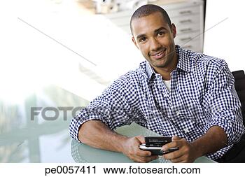 Stock Photography - businessman with 
sidekick at table 
in office. fotosearch 
- search stock 
photos, pictures, 
images, and photo 
clipart