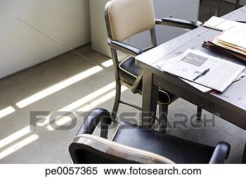 Stock Image - empty office chairs 
and paperwork. 
fotosearch - search 
stock photos, 
pictures, images, 
and photo clipart