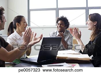 Stock Photo - four businesspeople 
in office applauding. 
fotosearch - search 
stock photos, 
pictures, images, 
and photo clipart