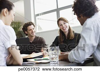 Stock Photo - four businesspeople 
in an office working. 
fotosearch - search 
stock photos, 
pictures, images, 
and photo clipart