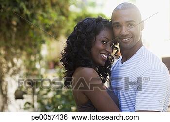 Stock Photo - couple embracing 
outdoors smiling. 
fotosearch - search 
stock photos, 
pictures, images, 
and photo clipart