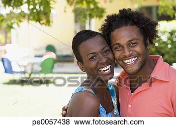 Stock Photo - couple embracing 
outdoors smiling. 
fotosearch - search 
stock photos, 
pictures, images, 
and photo clipart