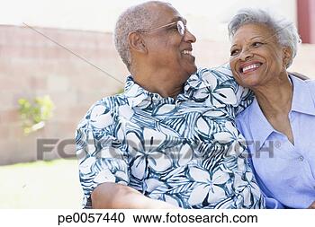 Stock Photography - couple embracing 
outdoors smiling. 
fotosearch - search 
stock photos, 
pictures, images, 
and photo clipart