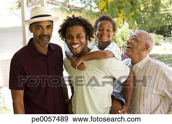 Stock Photograph - man piggybacking 
young boy with 
two older men 
standing beside 
him. fotosearch 
- search stock 
photos, pictures, 
images, and photo 
clipart