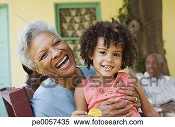 Stock Image - woman and young 
girl outdoors 
with people in 
background. fotosearch 
- search stock 
photos, pictures, 
images, and photo 
clipart