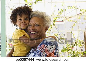 Stock Photo - woman and young 
girl embracing 
outdoors. fotosearch 
- search stock 
photos, pictures, 
images, and photo 
clipart