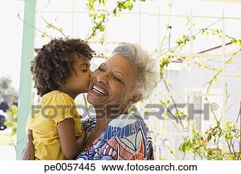 Stock Image - woman and young 
girl embracing 
outdoors. fotosearch 
- search stock 
photos, pictures, 
images, and photo 
clipart