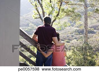 Stock Photo - couple embracing 
on staircase outdoors. 
fotosearch - search 
stock photos, 
pictures, images, 
and photo clipart