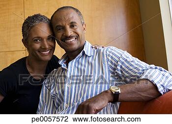 Stock Photo - couple on sofa 
in modern home. 
fotosearch - search 
stock photos, 
pictures, images, 
and photo clipart