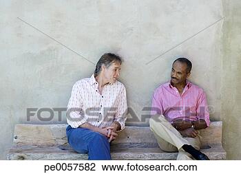 Stock Photo - two men outdoors 
on a wooden bench. 
fotosearch - search 
stock photos, 
pictures, images, 
and photo clipart
