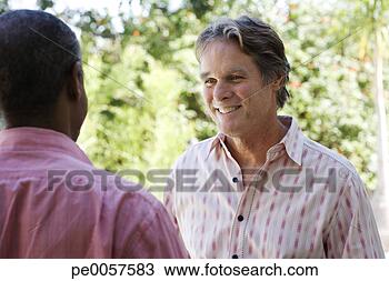 Stock Photo - two men outdoors. 
fotosearch - search 
stock photos, 
pictures, images, 
and photo clipart