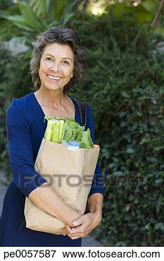Picture - woman carrying 
groceries in brown 
bag. fotosearch 
- search stock 
photos, pictures, 
images, and photo 
clipart