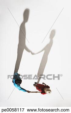 Picture - couple holding 
hands from a high 
angle view. fotosearch 
- search stock 
photos, pictures, 
images, and photo 
clipart