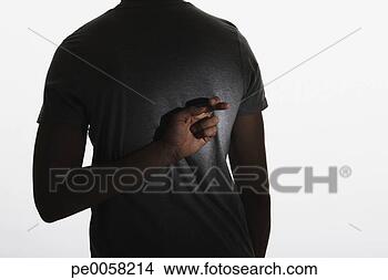 Stock Photo - man standing with 
fingers crossed 
behind back. fotosearch 
- search stock 
photos, pictures, 
images, and photo 
clipart
