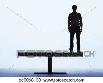 Stock Photo - man standing on 
a plank. fotosearch 
- search stock 
photos, pictures, 
images, and photo 
clipart