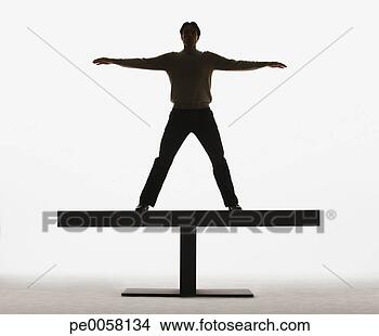 Stock Photo - man standing on 
a plank with arms 
out. fotosearch 
- search stock 
photos, pictures, 
images, and photo 
clipart