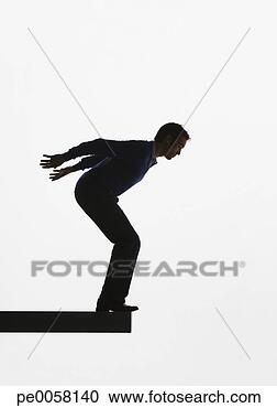 Stock Photography - man standing on 
a plank about 
to jump over ledge. 
fotosearch - search 
stock photos, 
pictures, images, 
and photo clipart