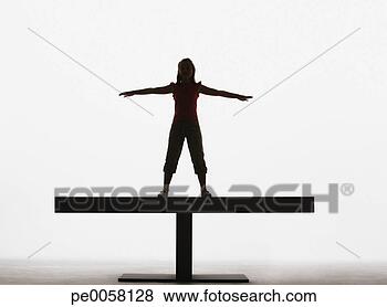 Stock Photo - small girl standing 
on a plank with 
arms out. fotosearch 
- search stock 
photos, pictures, 
images, and photo 
clipart