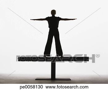 Stock Photography - woman standing 
on a plank with 
arms out. fotosearch 
- search stock 
photos, pictures, 
images, and photo 
clipart