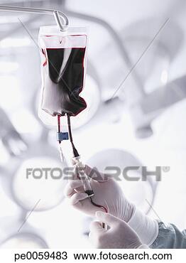 Stock Photo - doctor's hands 
adjusting an iv 
drip. fotosearch 
- search stock 
photos, pictures, 
images, and photo 
clipart