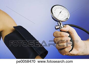 Stock Photography - hand holding gage 
for blood pressure 
device near patient's 
arm. fotosearch 
- search stock 
photos, pictures, 
images, and photo 
clipart