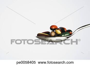 Stock Image - spoonful of pills. 
fotosearch - search 
stock photos, 
pictures, images, 
and photo clipart