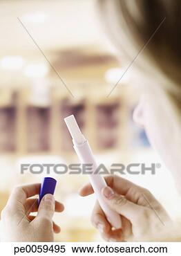 Stock Image - woman holding 
pregnancy test. 
fotosearch - search 
stock photos, 
pictures, images, 
and photo clipart