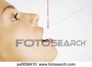 Stock Photography - woman taking medicine. 
fotosearch - search 
stock photos, 
pictures, images, 
and photo clipart